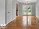 Bright dining room featuring hardwood floors, gray walls, and natural light from French doors at 120 E Beechwood Ln, Indianapolis, IN 46227