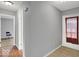 Entryway featuring tile flooring with a view of a room with hardwood flooring at 120 E Beechwood Ln, Indianapolis, IN 46227