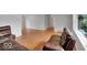 Spacious living room featuring hardwood flooring, large windows, and a leather couch set at 120 E Beechwood Ln, Indianapolis, IN 46227