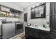 Laundry room with a washing machine, dryer, and overhead storage shelves at 1205 S Dequincy St, Indianapolis, IN 46203
