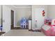 Additional angle of playroom featuring neutral walls, carpeted floors, and an array of toys at 1205 S Dequincy St, Indianapolis, IN 46203