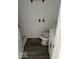 Compact bathroom with a toilet, small sink, and functional design at 1311 N Olney St, Indianapolis, IN 46201