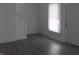 Inviting living room features modern gray flooring and neutral walls at 1311 N Olney St, Indianapolis, IN 46201
