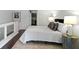 Modern bedroom with white walls, bedside tables, and frosted glass railing at 1471 N Delaware St, Indianapolis, IN 46202