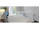 Modern bedroom with white walls and small fridge, and frosted-glass railing at 1471 N Delaware St, Indianapolis, IN 46202