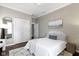 Comfortable bedroom features hardwood floors, soothing color palette, and ample closet space at 1471 N Delaware St, Indianapolis, IN 46202