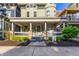 Charming two-story home featuring a welcoming front porch and landscaped front yard at 1471 N Delaware St, Indianapolis, IN 46202