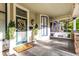 Cozy front porch with an inviting entrance, porch swing, and stylish decor at 1471 N Delaware St, Indianapolis, IN 46202
