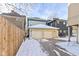 Detached two-car garage with snow-covered driveway, offering convenient parking and storage at 1471 N Delaware St, Indianapolis, IN 46202