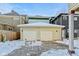 Two-car detached garage with snow, offering convenient parking and storage at 1471 N Delaware St, Indianapolis, IN 46202