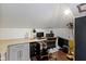 Home office featuring a built-in desk, ample lighting, and modern decor at 1471 N Delaware St, Indianapolis, IN 46202