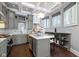 Well-lit kitchen featuring modern cabinetry, marble countertops, and a stylish pendant light at 1471 N Delaware St, Indianapolis, IN 46202