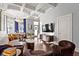 Bright open-concept living room with coffered ceilings, hardwood floors, and modern decor at 1471 N Delaware St, Indianapolis, IN 46202