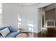 Stylish sitting area with dark hardwood floors and chair at 1471 N Delaware St, Indianapolis, IN 46202
