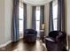 Bright sitting area with large windows, plush seating, hardwood floors, and a side table at 1471 N Delaware St, Indianapolis, IN 46202