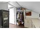 Large walk-in closet boasting custom shelving, hanging space, and a neutral color palette at 1471 N Delaware St, Indianapolis, IN 46202