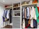 Spacious closet with built-in shelving and hanging rods for optimal storage and organization at 1471 N Delaware St, Indianapolis, IN 46202