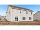 New construction home featuring a spacious backyard with sliding glass doors and multiple windows at 1585 N Regatta Dr, Greenfield, IN 46140