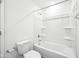 This all-white bathroom features a bathtub, shower, and toilet combination that's efficient and easy to clean at 1585 N Regatta Dr, Greenfield, IN 46140
