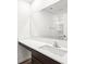 This bathroom offers a big mirror, white countertop and sink with brown cabinets beneath, perfect for getting ready at 1585 N Regatta Dr, Greenfield, IN 46140