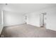 A large room with carpet flooring, multiple doorways, and great lighting at 1585 N Regatta Dr, Greenfield, IN 46140