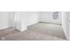 Spacious bedroom featuring neutral carpeting with a window and doorways to other rooms at 1585 N Regatta Dr, Greenfield, IN 46140
