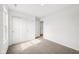 Bright bedroom with neutral carpet, double closet, and a window allowing natural light to fill the room at 1585 N Regatta Dr, Greenfield, IN 46140
