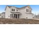 Beautiful two-story home with light siding, black shutters, and a convenient attached two-car garage at 1585 N Regatta Dr, Greenfield, IN 46140