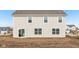 This home features a neutral siding, plenty of windows, and a glass sliding door to the backyard at 1585 N Regatta Dr, Greenfield, IN 46140