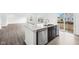 The kitchen features stainless steel appliances and an island with a sink at 1585 N Regatta Dr, Greenfield, IN 46140