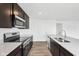 A beautifully appointed kitchen with stainless steel appliances and granite countertops at 1585 N Regatta Dr, Greenfield, IN 46140