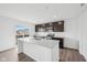 Modern kitchen featuring granite countertops, stainless appliances, and sliding glass doors to the outside at 1585 N Regatta Dr, Greenfield, IN 46140
