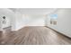 Inviting living room featuring attractive wood-look flooring and a bright, airy atmosphere at 1585 N Regatta Dr, Greenfield, IN 46140