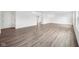 Spacious living room featuring beautiful wood-look flooring and ample natural light at 1585 N Regatta Dr, Greenfield, IN 46140