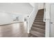 Carpeted stairs lead to the second floor, with windows providing natural light to the entryway at 1585 N Regatta Dr, Greenfield, IN 46140