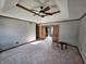 Spacious bedroom with tray ceilings, carpet flooring, a ceiling fan, and an ensuite bathroom at 16575 Audubon Ct, Noblesville, IN 46060