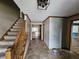 Inviting entryway features a carpeted staircase, tiled flooring, and neutral paint, leading to other areas of the home at 16575 Audubon Ct, Noblesville, IN 46060