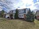 Charming two-story home with gray siding, brick accents and well-manicured landscaping at 16575 Audubon Ct, Noblesville, IN 46060