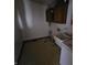 Functional laundry room with a utility sink, cabinets, and vinyl flooring at 16575 Audubon Ct, Noblesville, IN 46060