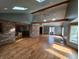 Open living room with skylights, wood beams and hardwood flooring throughout at 16575 Audubon Ct, Noblesville, IN 46060