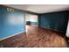 Spacious living room with hardwood floors, wood trim, and fresh, neutral paint at 16575 Audubon Ct, Noblesville, IN 46060