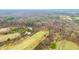 Overhead shot showing a landscape dotted with trees, meadows, and the flowering of early spring blossoms at 1794 Bell Rd, Morgantown, IN 46160