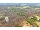 Aerial shot displaying a blend of woodland, ponds, and fields, providing a sense of the property’s varied landscape at 1794 Bell Rd, Morgantown, IN 46160