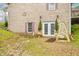 Brick home basement has a walkout and is surrounded by stone landscaping at 1794 Bell Rd, Morgantown, IN 46160