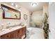 Bathroom with a wooden frame mirror, granite countertops, toilet, and shower with glass doors at 1794 Bell Rd, Morgantown, IN 46160