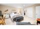 A bedroom with carpet, a queen bed, and lots of natural light from large windows at 1794 Bell Rd, Morgantown, IN 46160