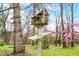 Rustic log birdhouse in yard at 1794 Bell Rd, Morgantown, IN 46160