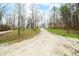 Scenic dirt road leading to a secluded property, surrounded by trees and natural beauty at 1794 Bell Rd, Morgantown, IN 46160