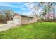 Charming brick home with attached garage and sprawling green lawn under a partly cloudy sky at 1794 Bell Rd, Morgantown, IN 46160