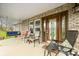 Covered front porch with seating and a swing at 1794 Bell Rd, Morgantown, IN 46160